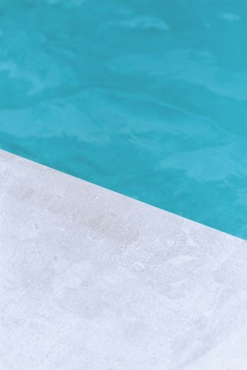 empty gray floor beside pool