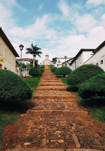 Empty Pathway Leading To Houses