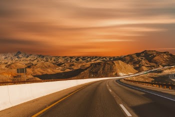 Empty Road Beside Sand Dunes