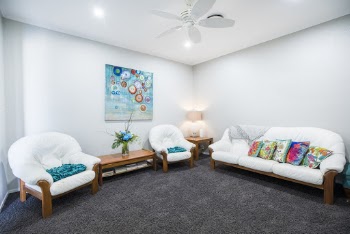 Empty Sofa With Multicolored Throw Pillows