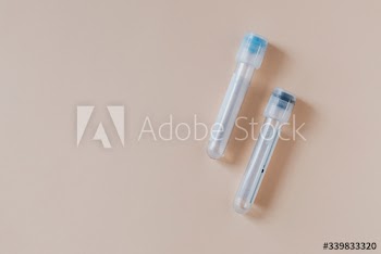 Empty test tubes on a beige background