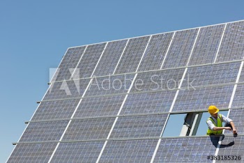 Engineer examining solar panels
