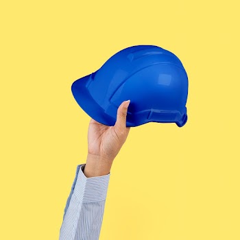 Engineer hard hat held by a hand jobs and… | Free stock photo | High Resolution image