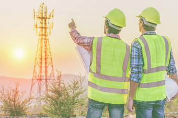 Engineers Planning Construction at Sunset