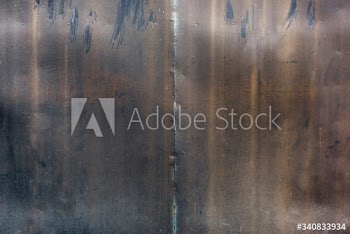 Eroded metal wall