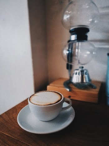 Espresso in White Ceramic Mug on Saucer