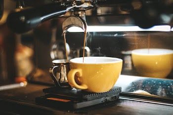 Espresso Machine Dispensing on Two Mugs