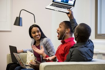Excited Friends On Couch