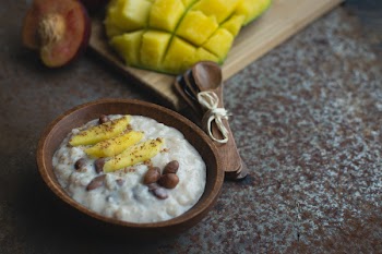 Exotic coconut rice and beans dessert with mango 