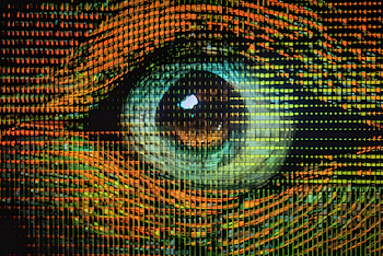 Extreme close up of a cybernetic eye glitching into dot matrix, horizontal shot