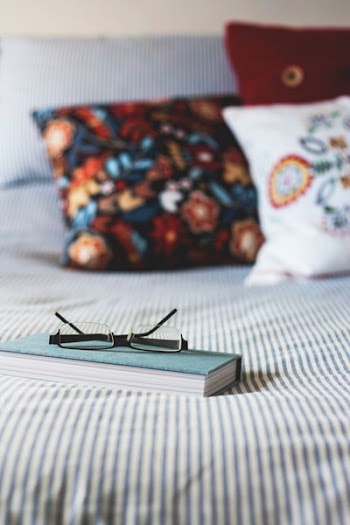 eyeglasses on book