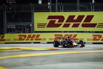 F-1 race car driving on road