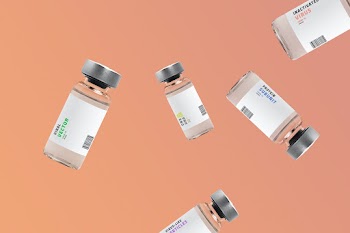 Falling COVID-19 vaccine injection bottles with orange background