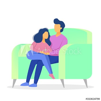 Family couple sitting at home on couch together