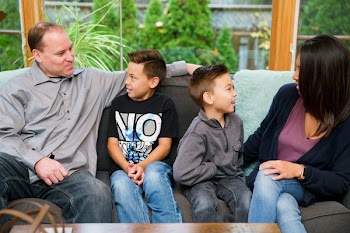 Family Sitting On Couch