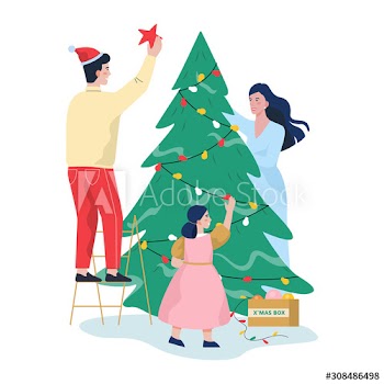 Family standing at the christmas tree