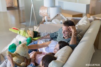 Family with stuffed animals moving into new house