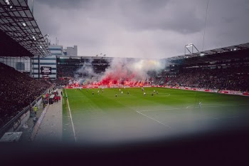 Fans of St. Pauli (Hamburg) burning pyrotechnics in the local derby against Hamburger SV.