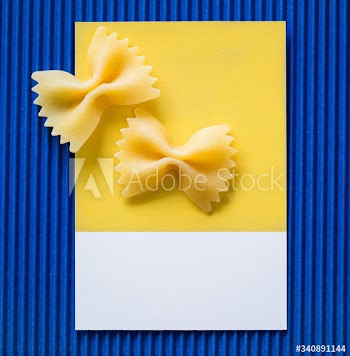 Farfalle pasta on a yellow card