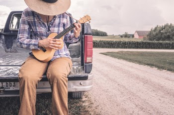 Farmer Playing Small Guitar Free Photo 