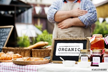 Farmer selling organic produce at a local fresh market
