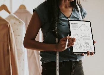 Fashion designer presenting her design | Free PSD Mockup - rawpixel