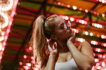 Fashion Model Under Carnival Lights