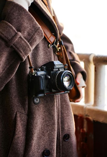 Fashionable Photographer with Classic Camera