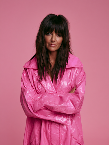Fashionable Woman in Pink Shiny Raincoat