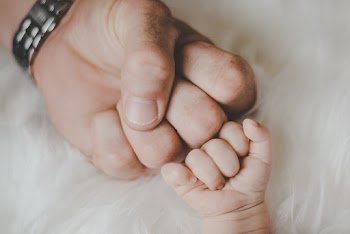 Father And Baby's Fist 