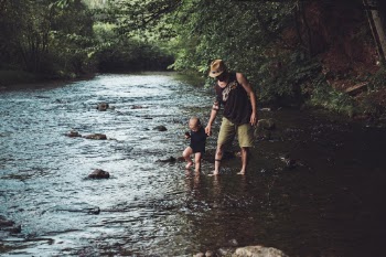 Father and son in the river