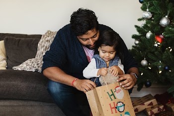Father And Son Open Christmas Gifts