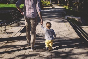 Father and son walking