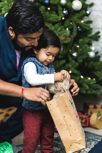 Father Helps Toddler Open Christmas Gifts