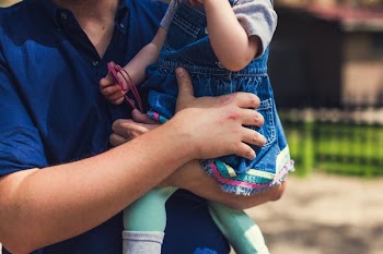 Father Holding Baby Girl