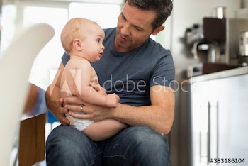 Father holding baby son