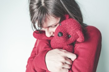 Fearful Girl Hugging Teddy Free Photo 