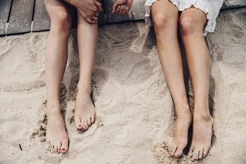 Feet In Beach Sand