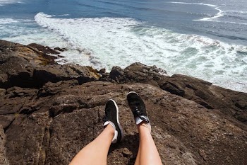 Feet On Rocky Shore