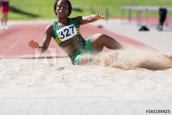 Female athlete long jumping