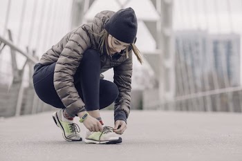 Female Athlete Tying Her Shoes