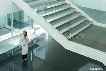 Female doctor in modern hospital lobby