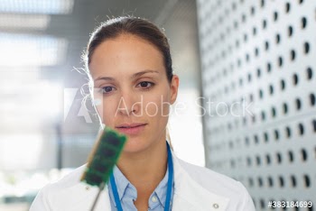 Female engineer examining computer chip