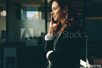Female executive talking on cell phone