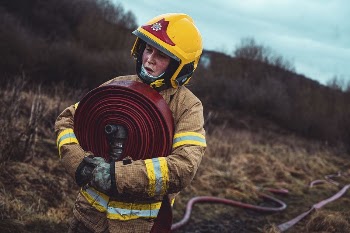Female firefighter, hose relay training, | Free Photo - rawpixel