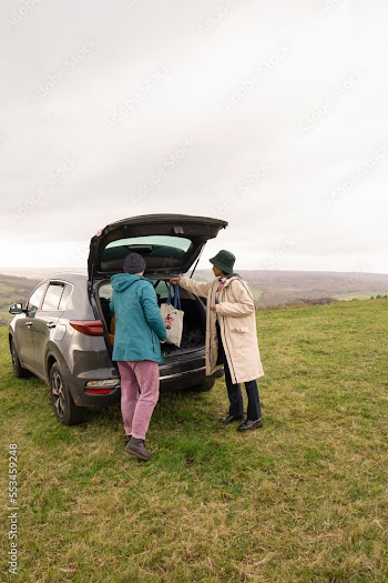 Female friends packing car for hiking trip