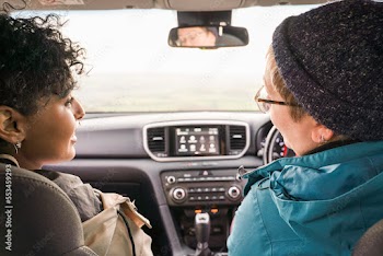 Female friends traveling by car
