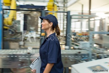 Female manager walking in food processing plant