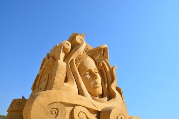 Female Sand Sculpture during Daytime