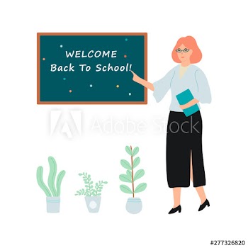 Female teacher standing at the blackboard with welcome